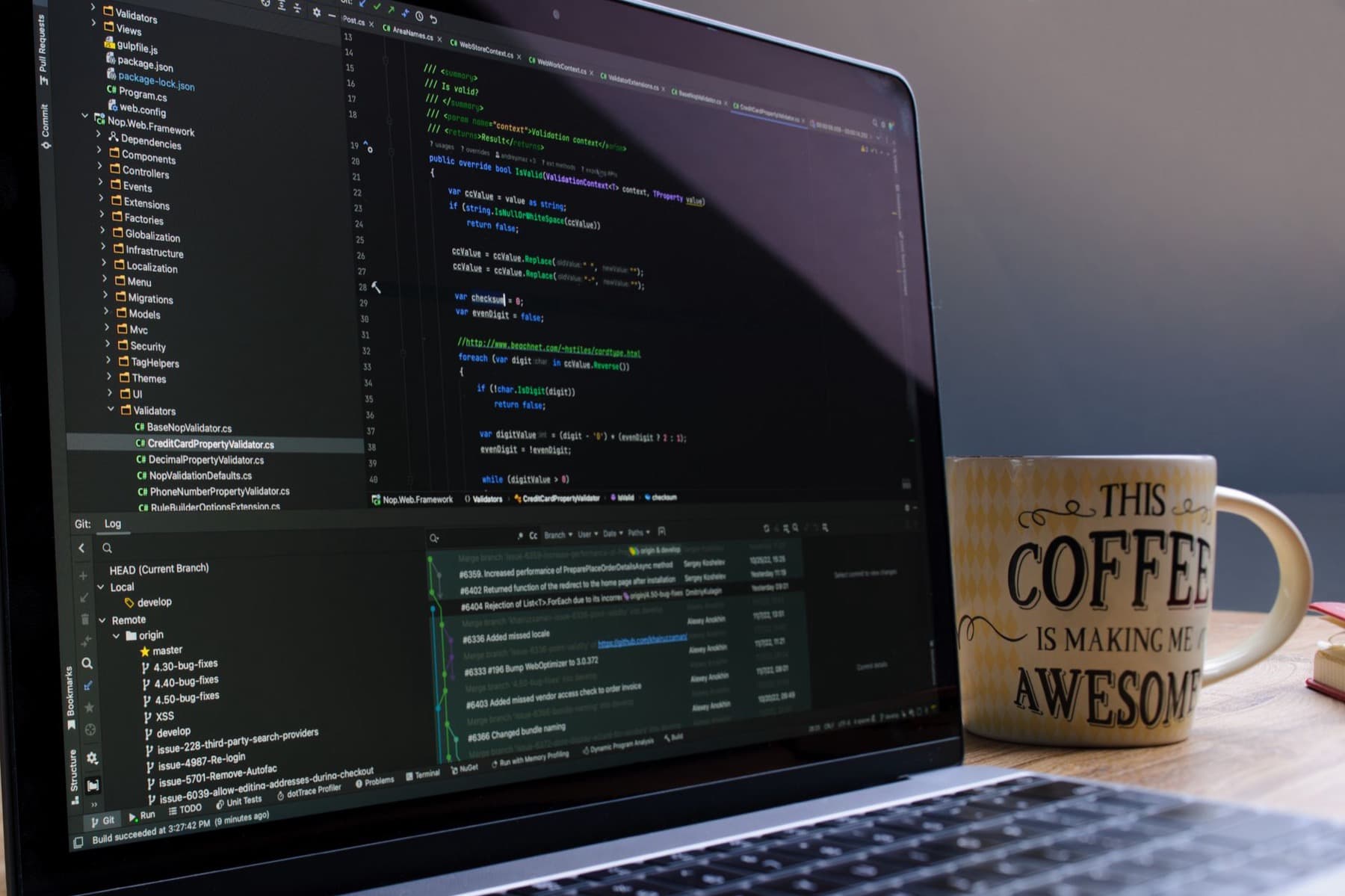 A desk with a laptop and coffee