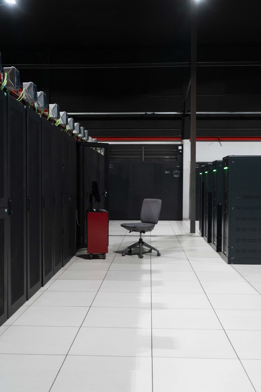 Server racks in a data centre, the infrastructure behind the work we quote for