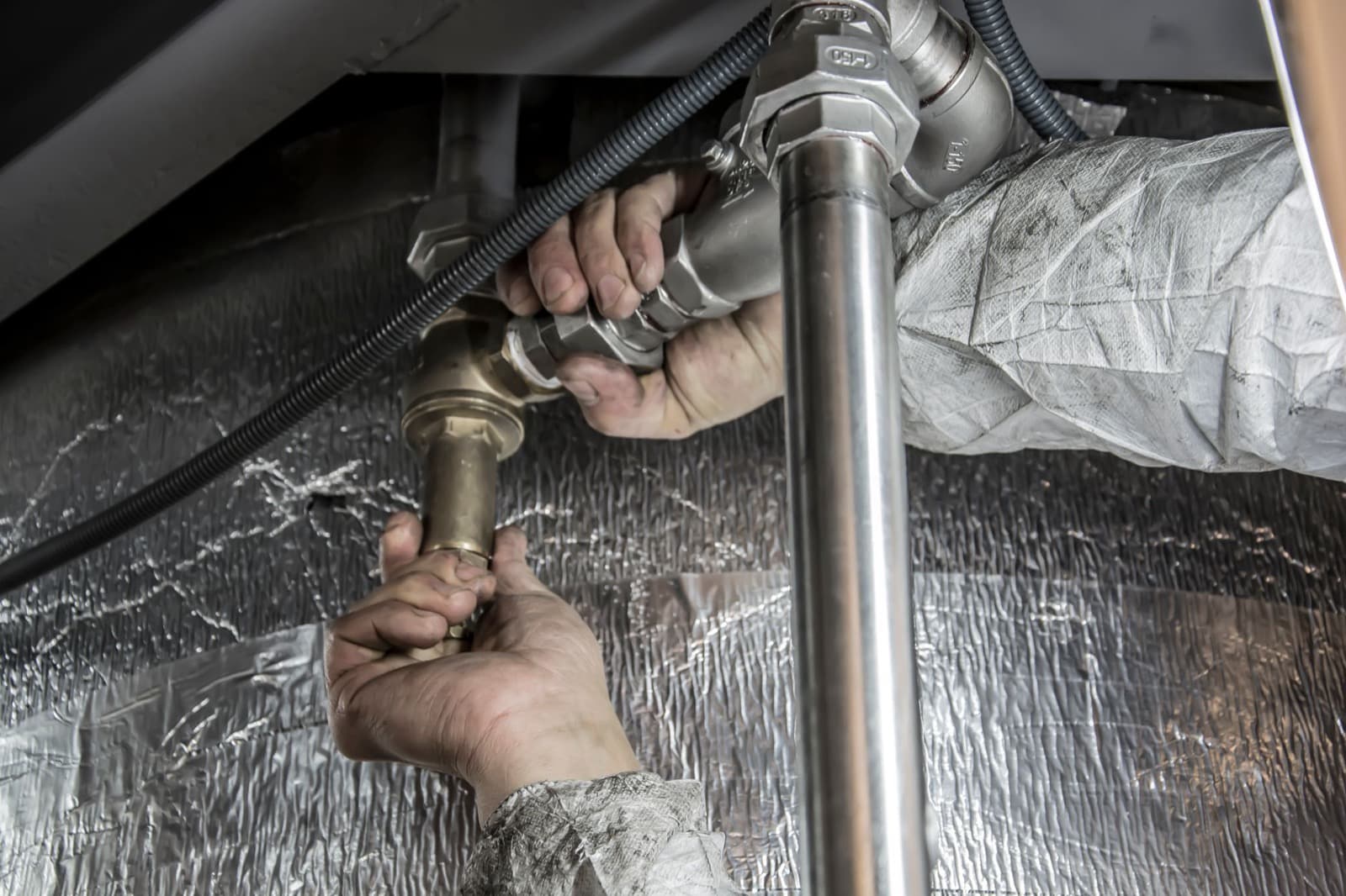 Engineer working on pipework